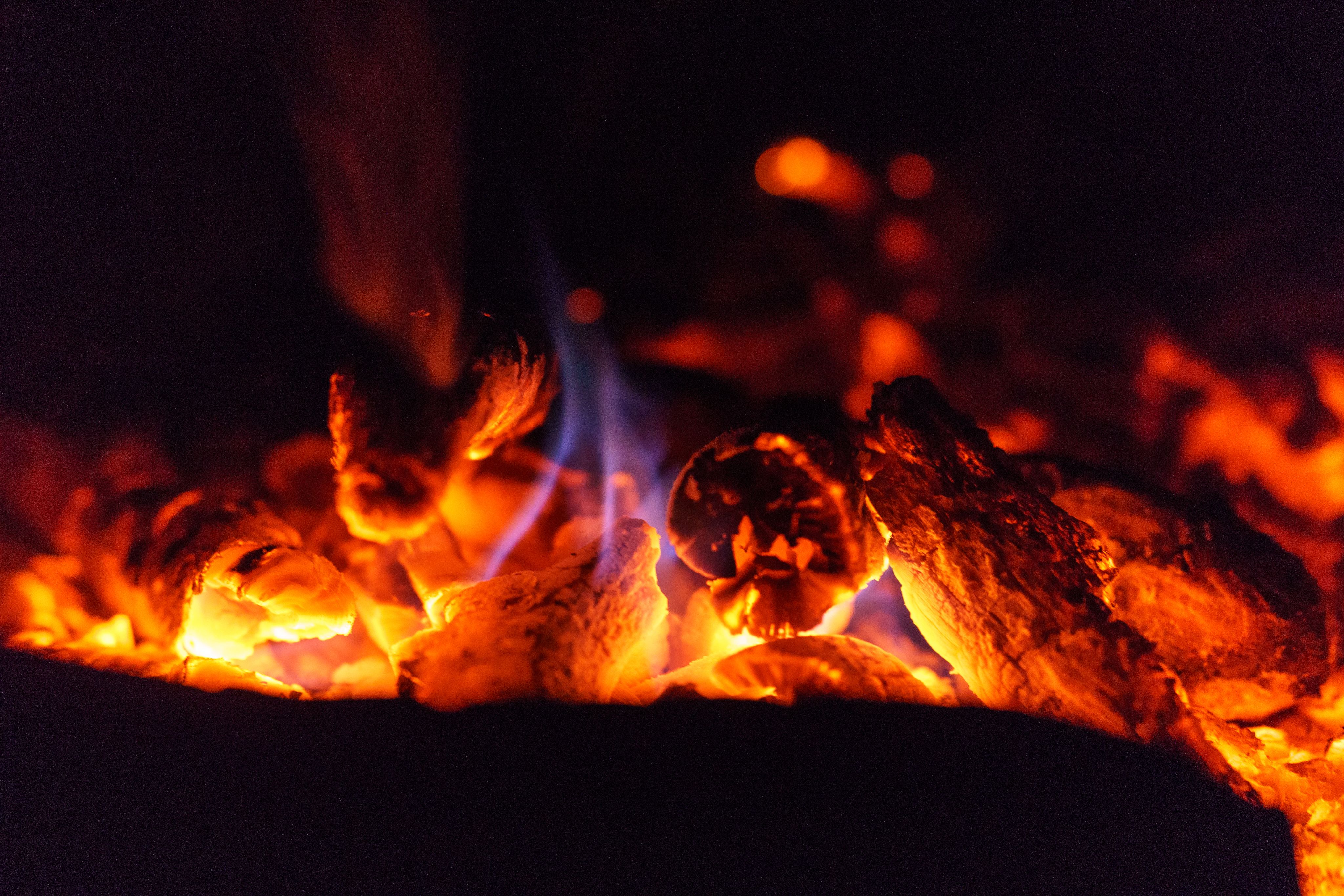 coal burning and giving off heat and smoke