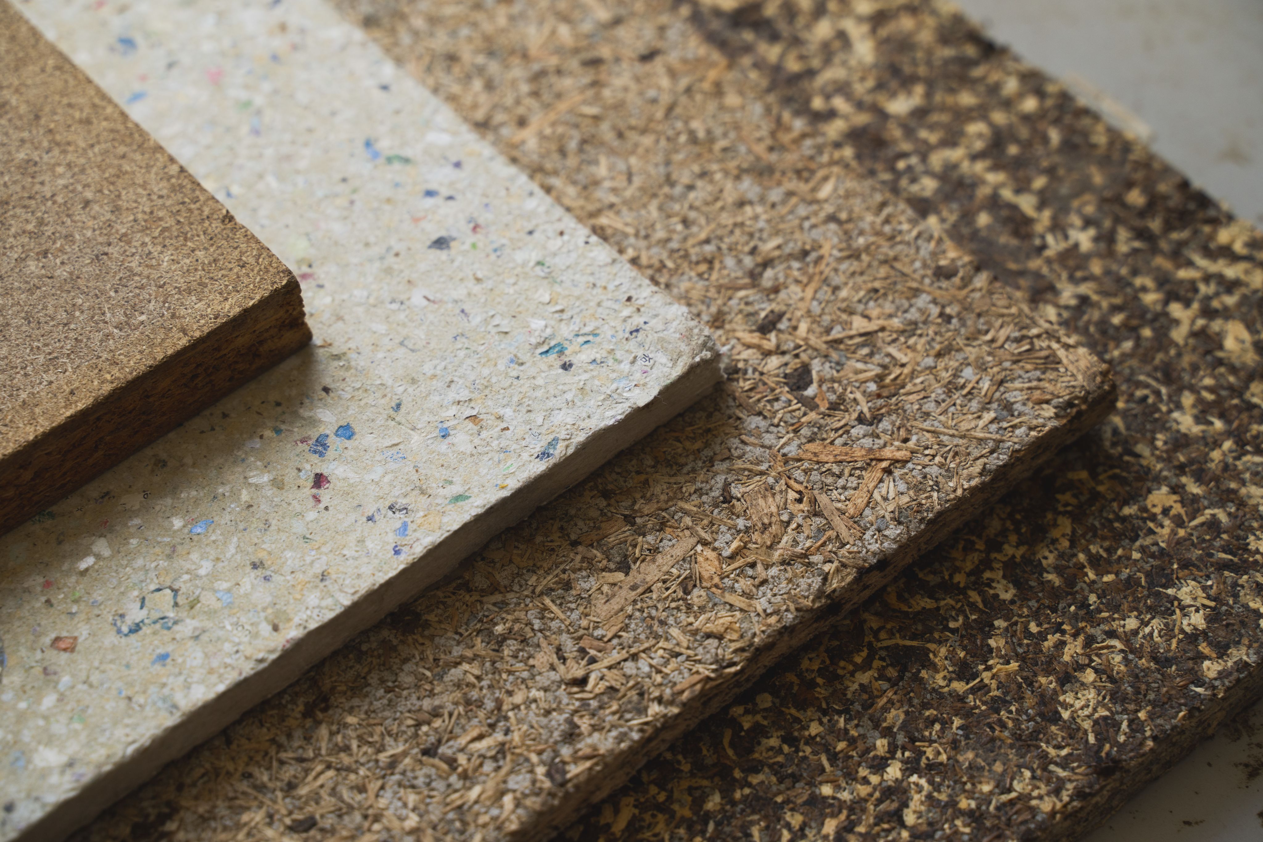 Samples of chip board produced using the Cambond manufacturing process showing coloured flecks