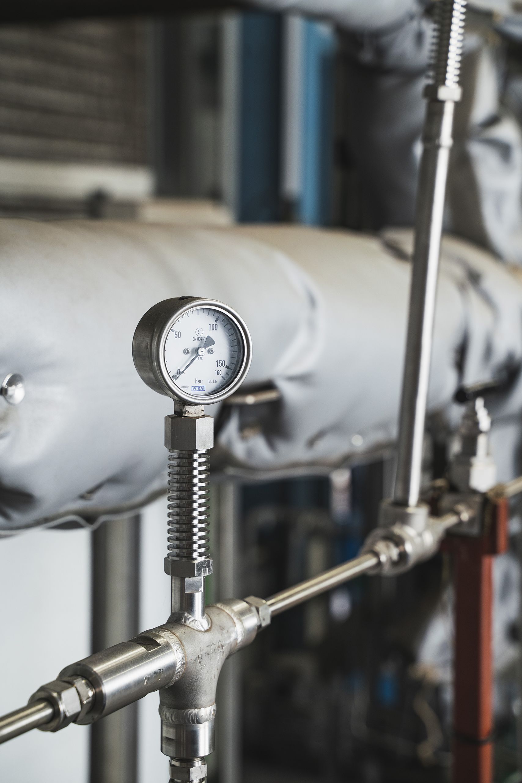 A pressure gauge on industrial equipment