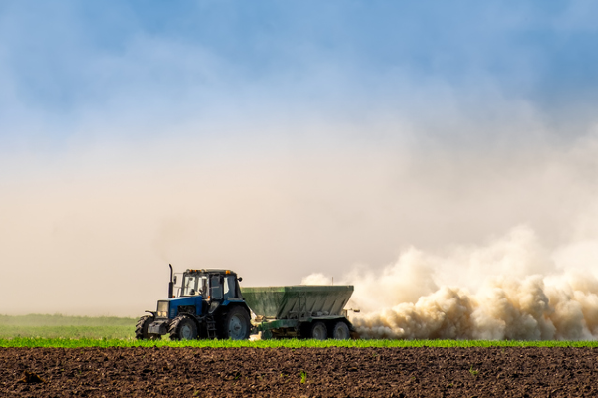 Tractor farming in field