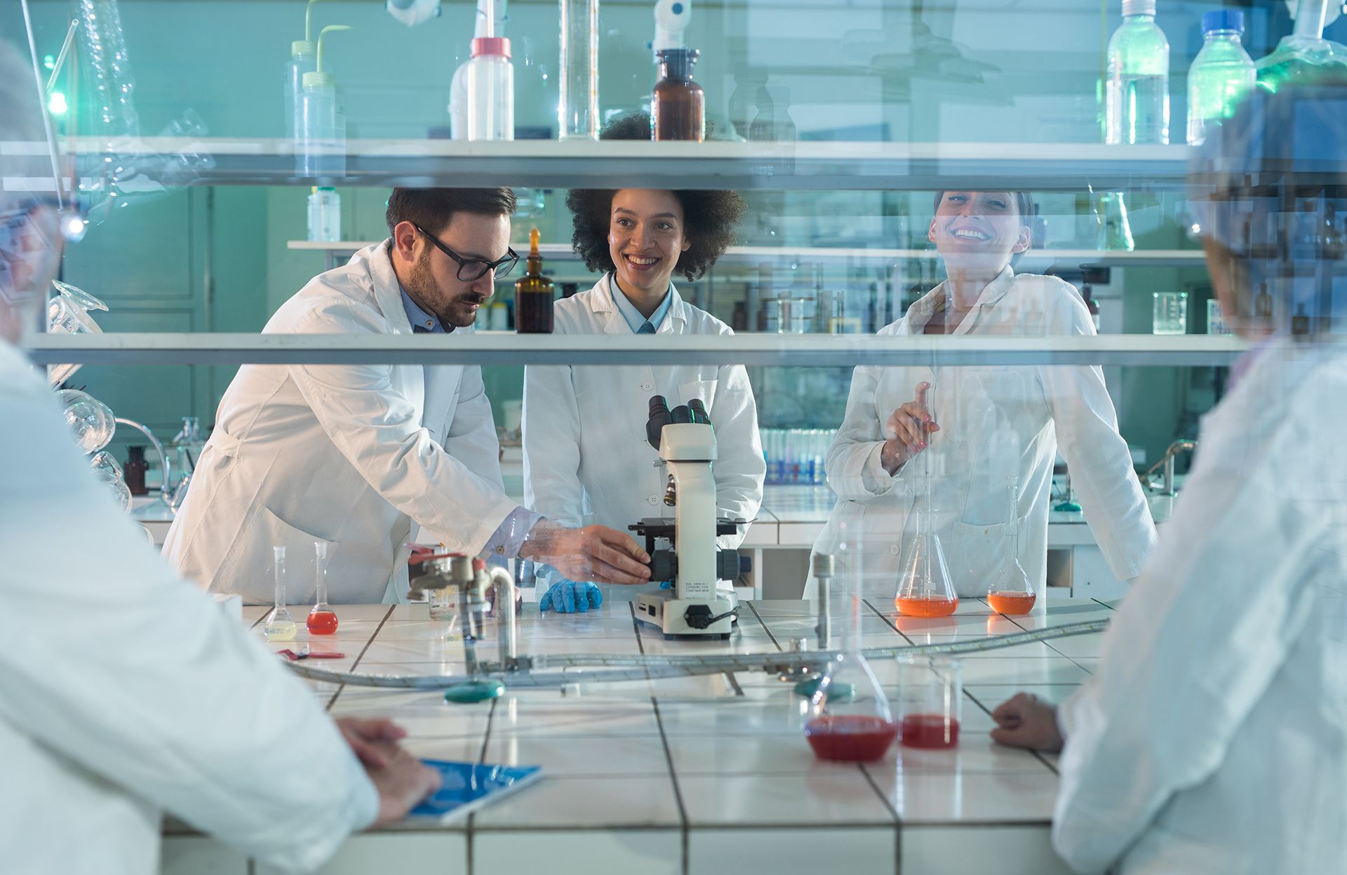 A group of scientists working together in a laboratory.