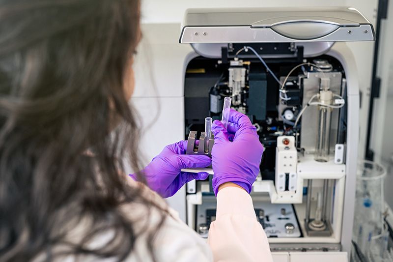 A researcher using flow cytometry equipment Credit: The Babraham Institute
