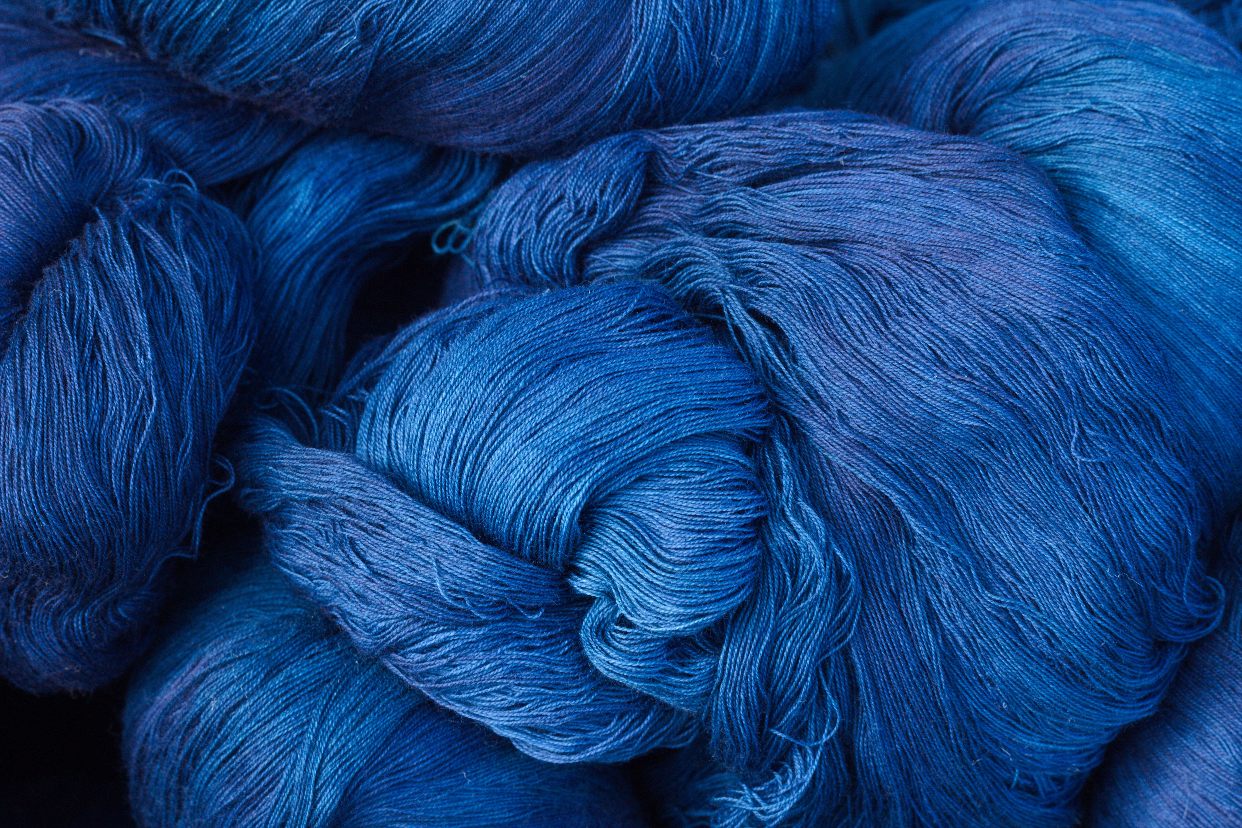 Hanks of yarn dyed a shade of deep blue