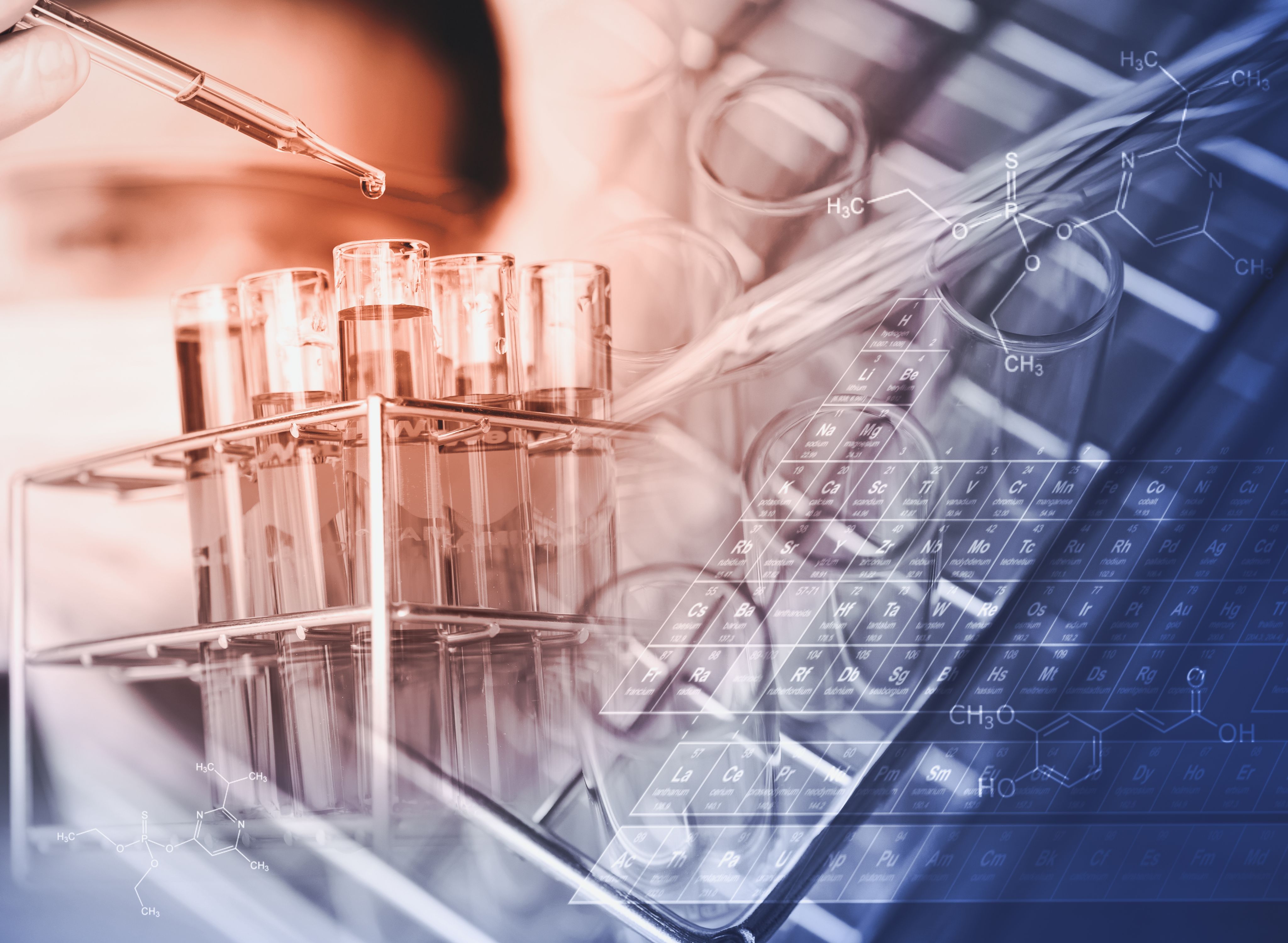 A stylised image of a laboratory worker dropping liquid into a test tube