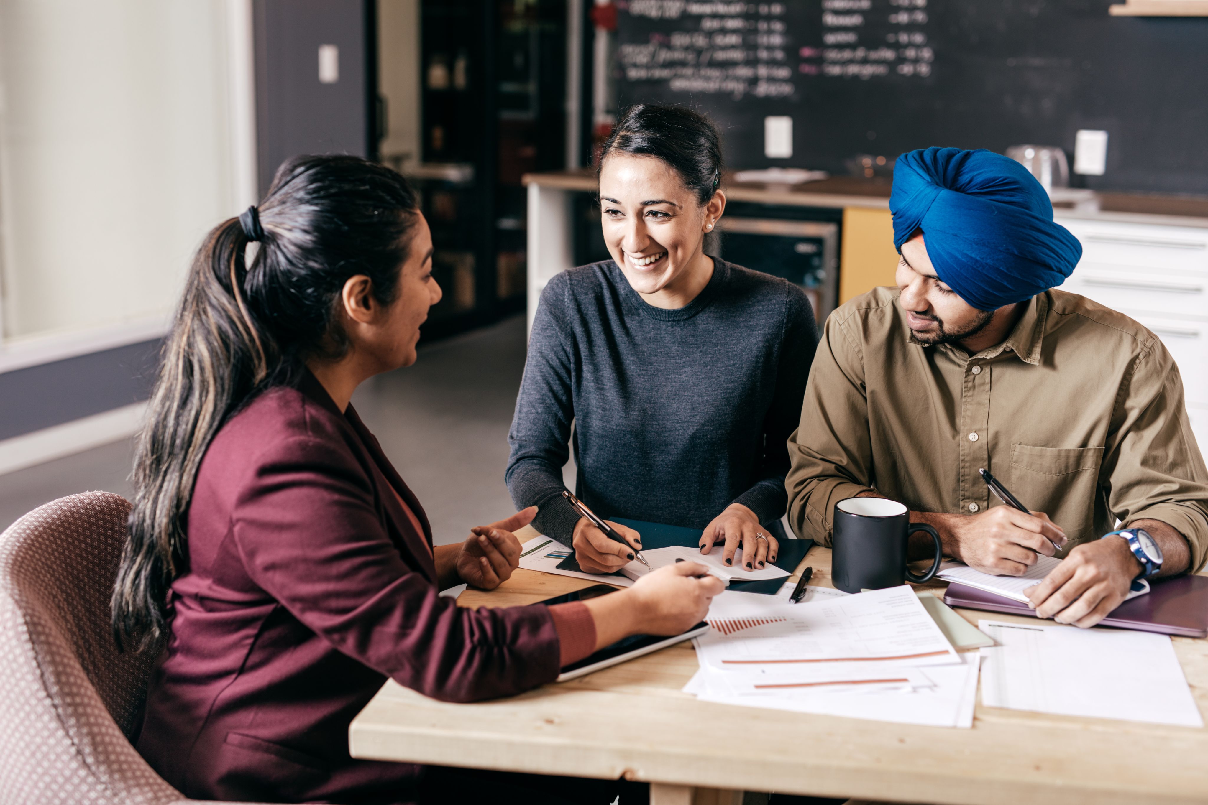 A group of people meeting in a cafe