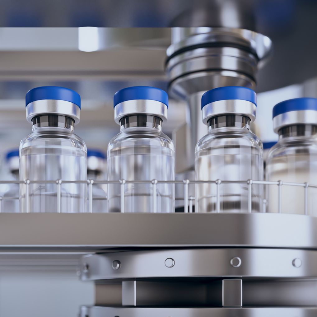 Vaccine bottles on a conveyor line