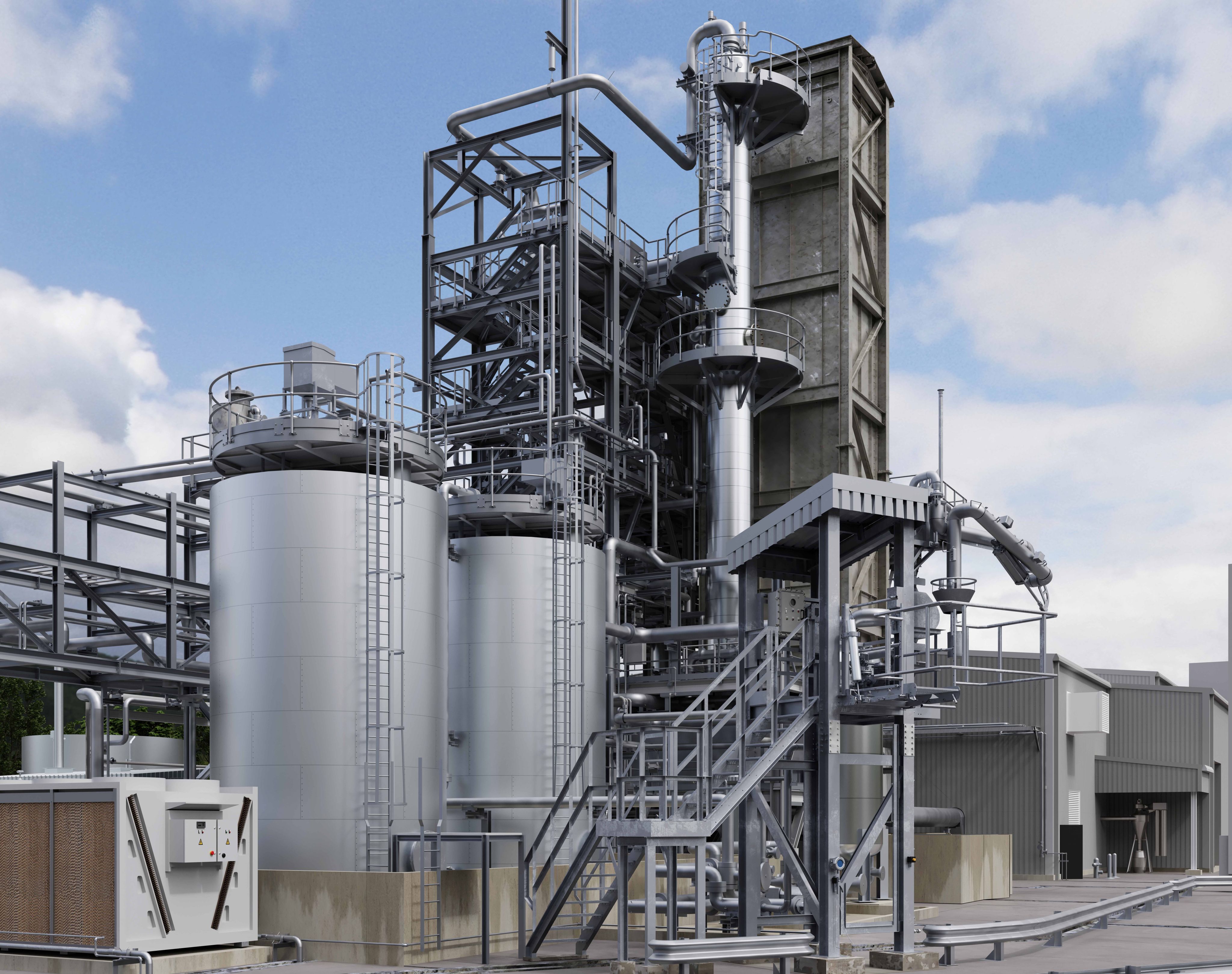 Outdoor image looking at the main process structure at the Wilton plant. In the foreground are two large cylinder tanks with pipework coming from the top of each, around them is a frame structure of industrial stairs and walkways that allow access. In the background you see other plant building and structures, heading into the distance.