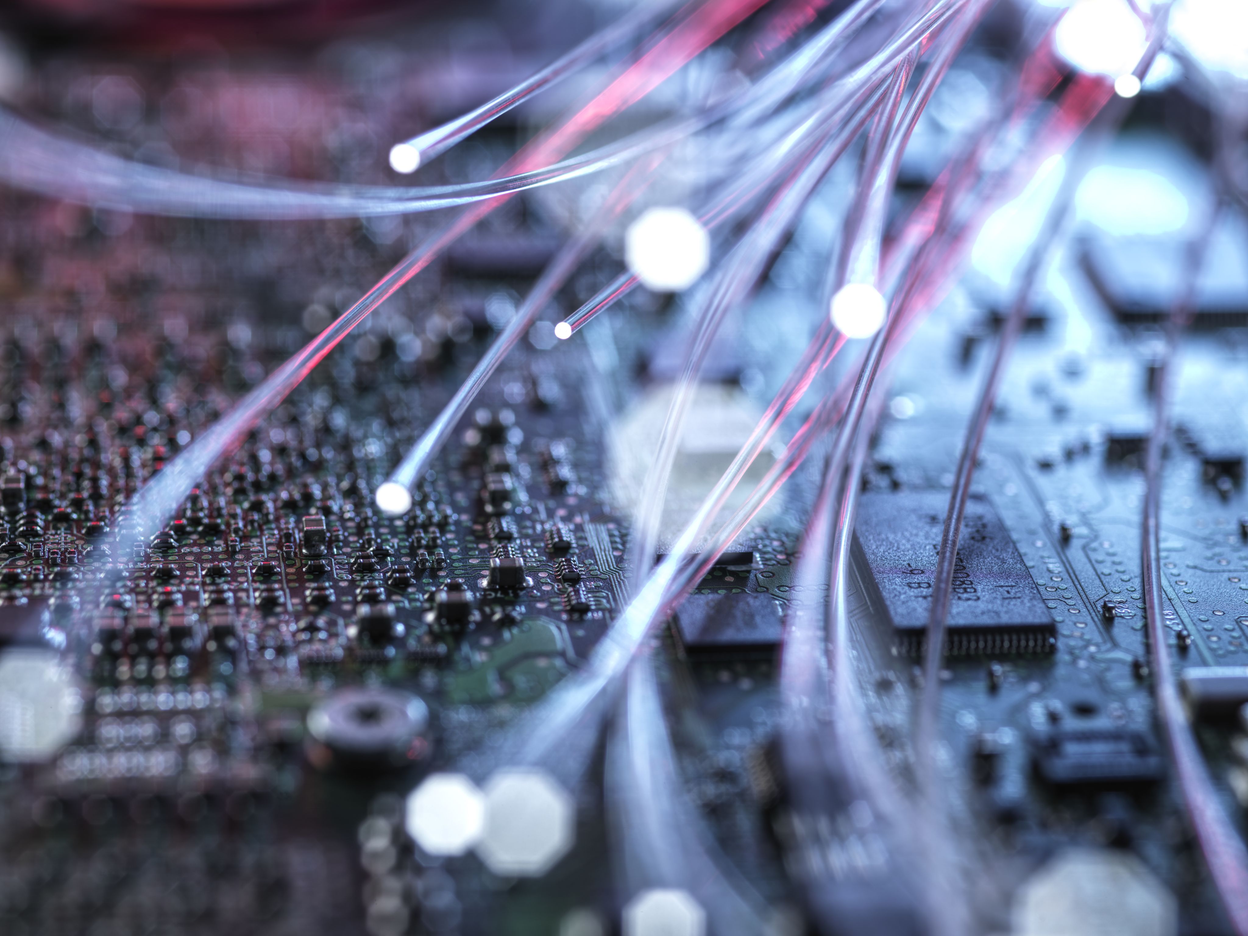 Fibre optics carrying data passing through computer circuit boards
